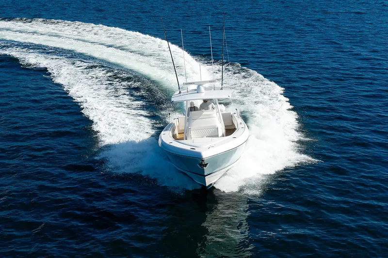 Slide: The Image of 2017 Intrepid 375 Nomad FE cruising on open blue water. - 26