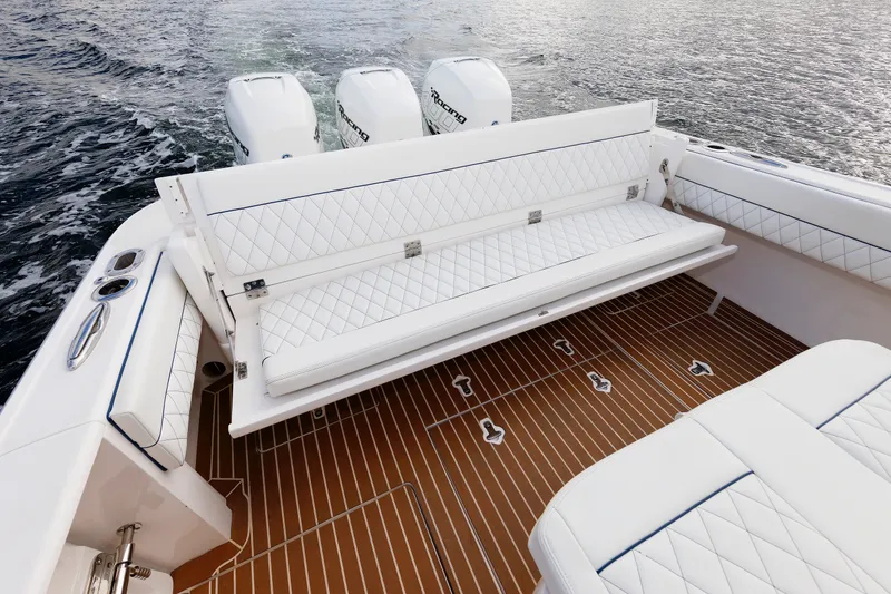 Slide: The Image of 2017 Intrepid 375 Nomad FE boat with luxurious seating and powerful engines on water. - 34