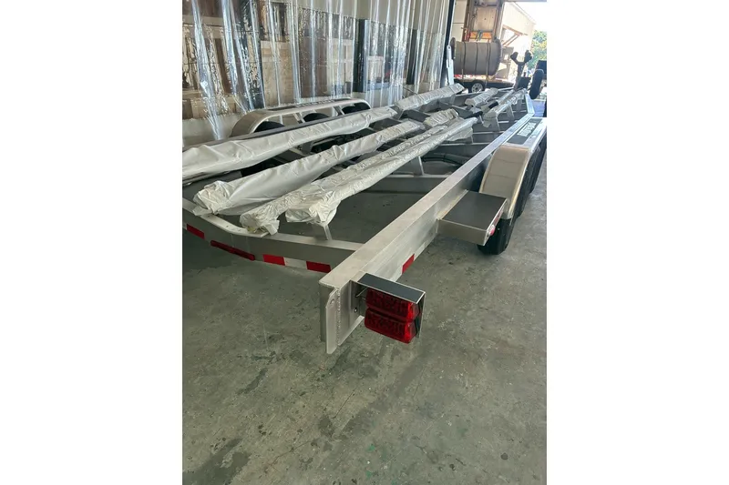 Slide: The Image of Trailer for 2017 Intrepid 375 Nomad FE boat in a garage setting. - 63