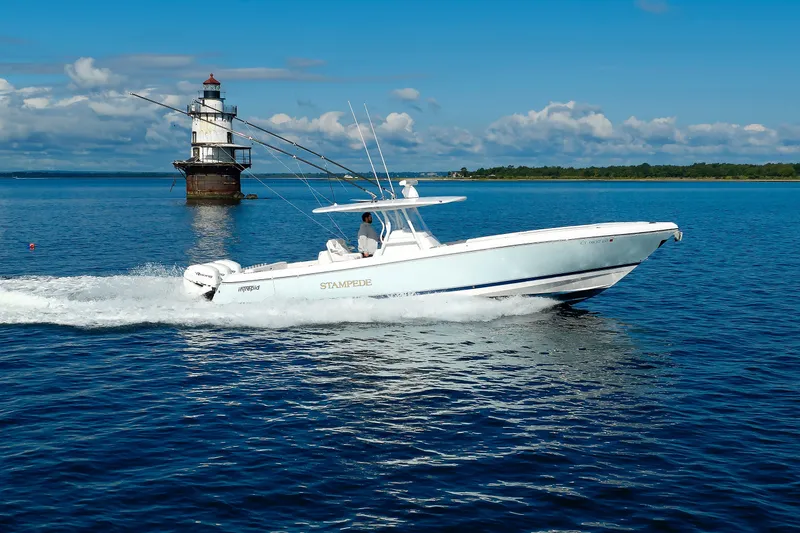 Slide: The Image of 2017 Intrepid 375 Nomad FE cruising near a lighthouse on a sunny day. - 24