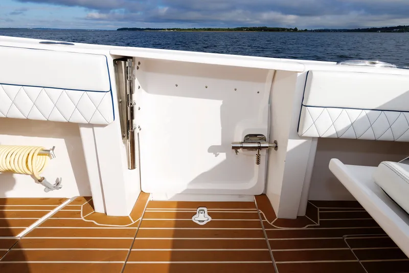 Slide: The Image of 2017 Intrepid 375 Nomad FE boat deck with cushioned seating and ocean view. - 39