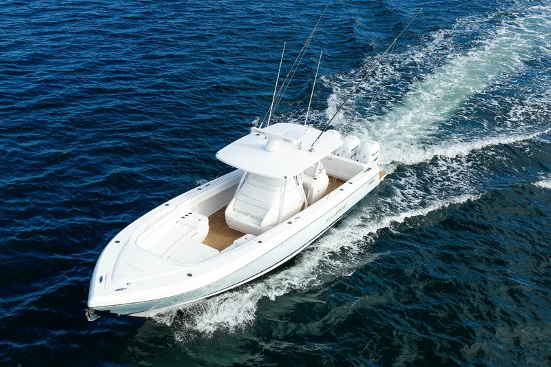 Slide: The Image of 2017 Intrepid 375 Nomad FE boat cruising on open water. - 15