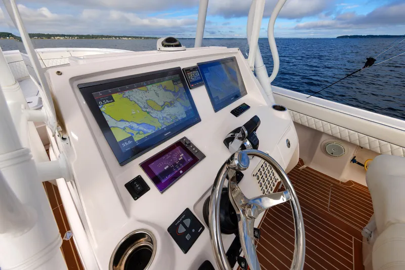 Slide: The Image of Cockpit view of 2017 Intrepid 375 Nomad FE with navigation screens and steering wheel. - 47