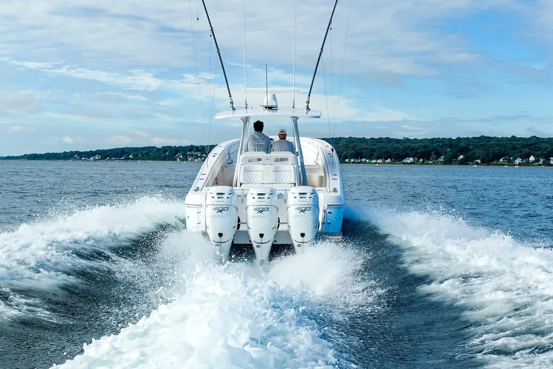 Slide: The Image of 2017 Intrepid 375 Nomad FE cruising on open water, rear view. - 20