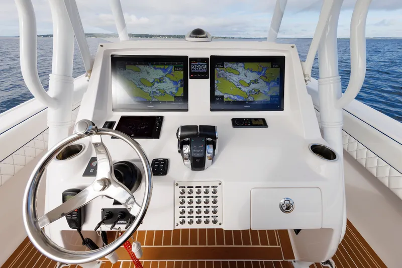 Slide: The Image of Intrepid 375 Nomad FE 2017 helm with dual navigation screens and steering wheel. - 48