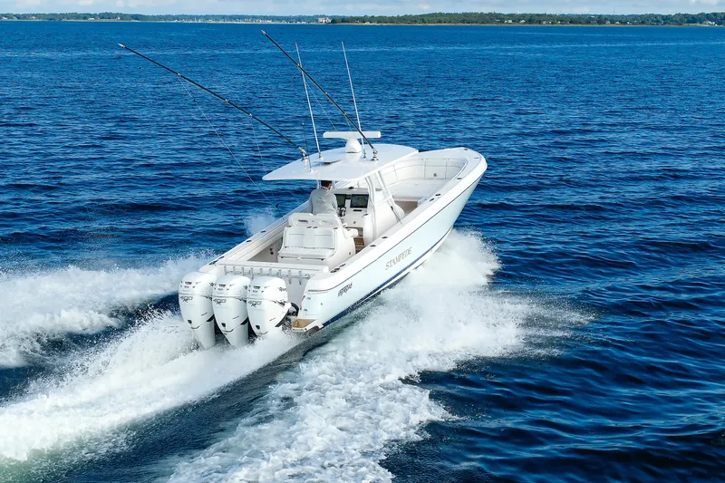 Slide: The Image of 2017 Intrepid 375 Nomad FE cruising on open blue waters. - 22