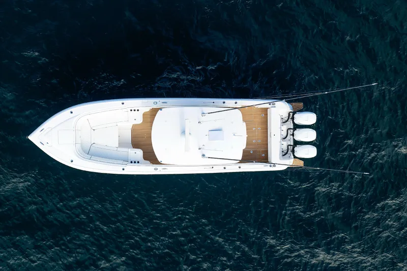 Slide: The Image of Aerial view of 2017 Intrepid 375 Nomad FE boat on deep blue water. - 14