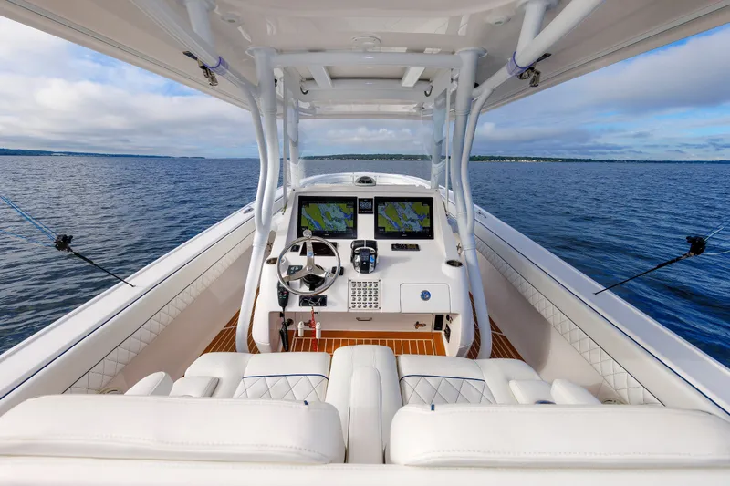 Slide: The Image of 2017 Intrepid 375 Nomad FE boat interior with navigation system on open water. - 46