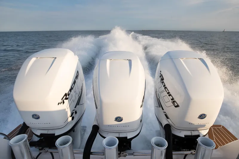 Slide: The Image of Triple Mercury Racing outboard engines powering a 2017 Intrepid 375 Nomad FE on open water. - 12