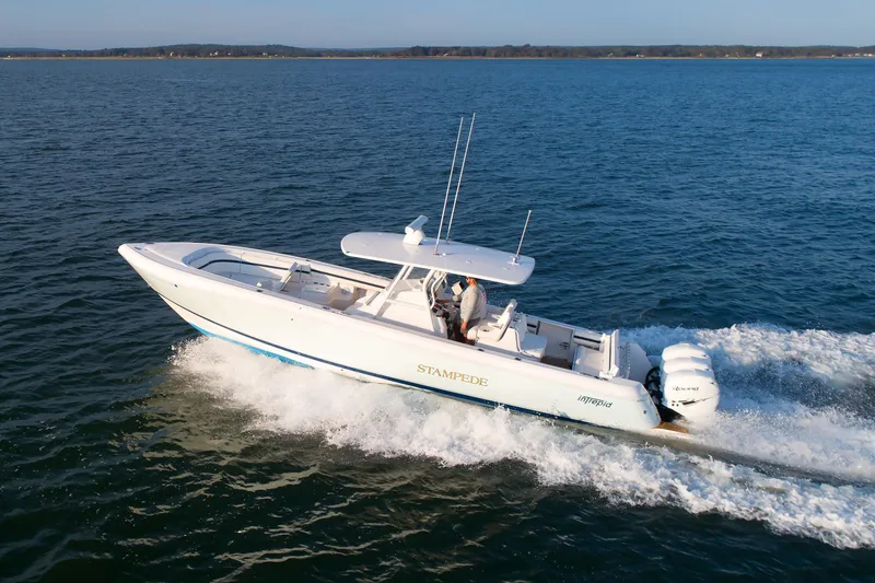 Slide: The Image of 2017 Intrepid 375 Nomad FE boat cruising on open water. - 8