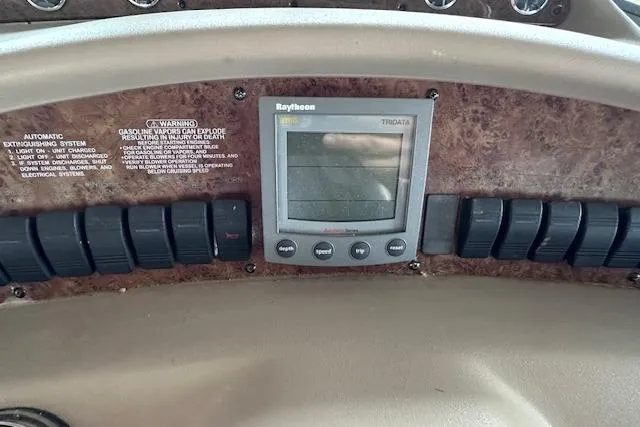 Slide: The Image of Control panel of 2001 Sea Ray 340 Sundancer with Raytheon Tridata display. - 11