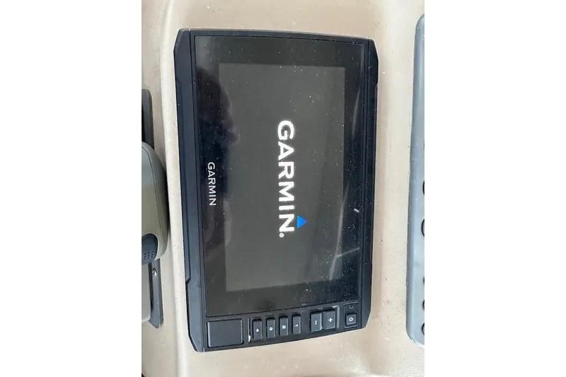 Slide: The Image of Garmin navigation device on 2001 Sea Ray 340 Sundancer boat dashboard. - 12
