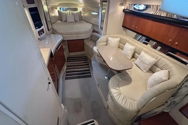 Slide: The Image of Luxurious interior of 2001 Sea Ray 340 Sundancer yacht with cozy seating and elegant design. - 17