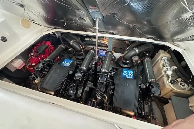 Slide: The Image of Engine compartment of a 2001 Sea Ray 340 Sundancer boat, showcasing dual engines. - 24