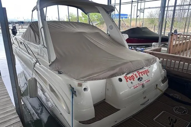 Slide: The Image of 2001 Sea Ray 340 Sundancer docked, covered, and secured in a marina. - 28