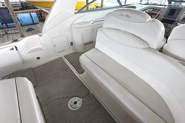 Slide: The Image of 2001 Sea Ray 340 Sundancer interior with white seating and carpeted floor. - 6