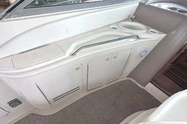 Slide: The Image of 2001 Sea Ray 340 Sundancer interior with sink and storage cabinets. - 7