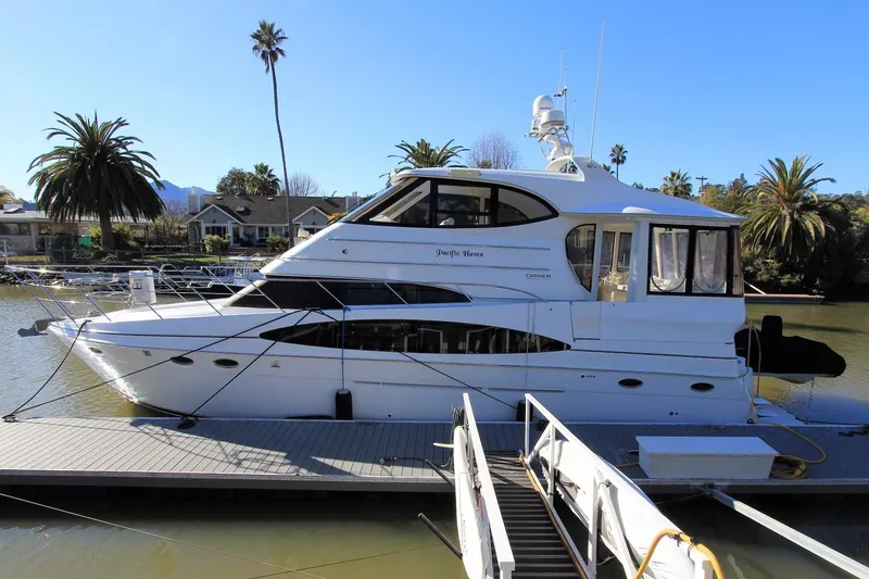 The Image of 2001 Carver 506 Motor Yacht docked on a sunny day. - 0