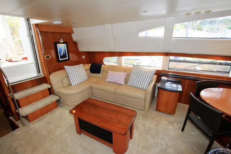 Slide: The Image of Interior of 2001 Carver 506 Motor Yacht with sofa and table. - 13