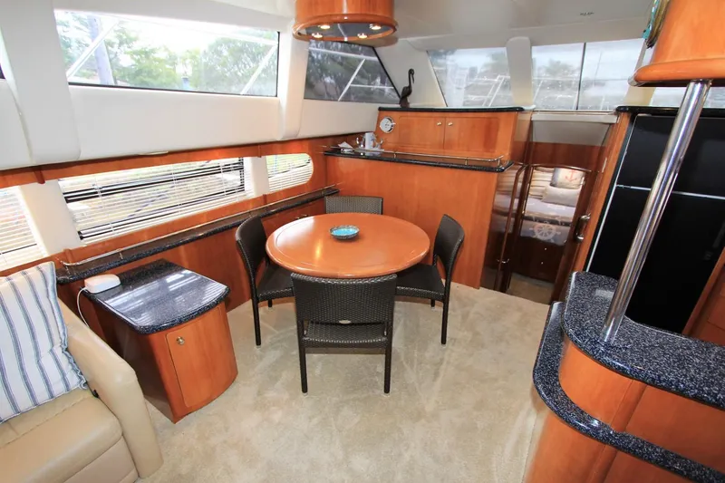 Slide: The Image of Interior of 2001 Carver 506 Motor Yacht with dining area and kitchen. - 14