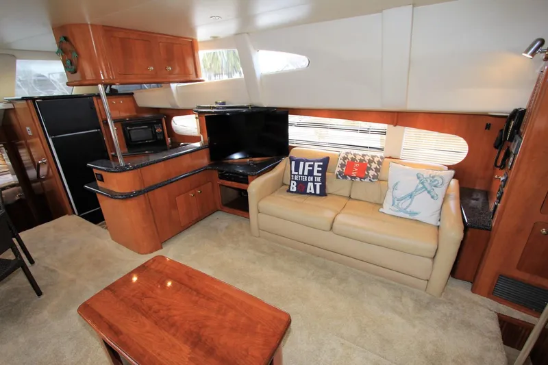 Slide: The Image of Interior of 2001 Carver 506 Motor Yacht with sofa and kitchen. - 16
