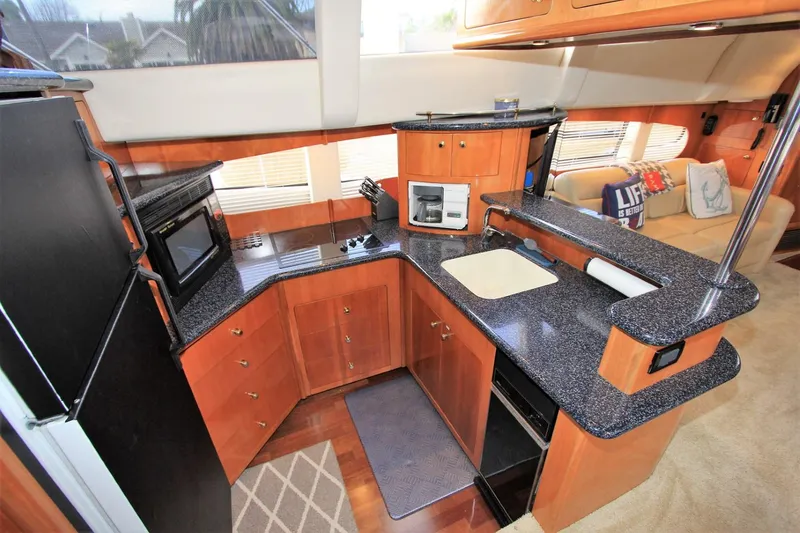 Slide: The Image of Interior of 2001 Carver 506 Motor Yacht featuring modern kitchen. - 17