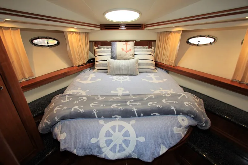 Slide: The Image of Interior of 2001 Carver 506 Motor Yacht with nautical bedding decor. - 22