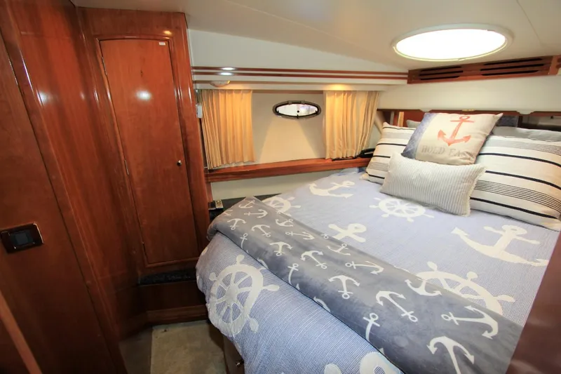Slide: The Image of Interior of 2001 Carver 506 Motor Yacht with nautical bedding decor. - 23