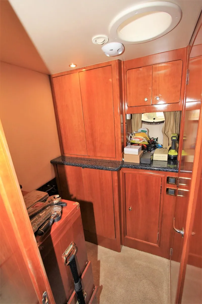 Slide: The Image of Interior of 2001 Carver 506 Motor Yacht with wooden cabinetry. - 28