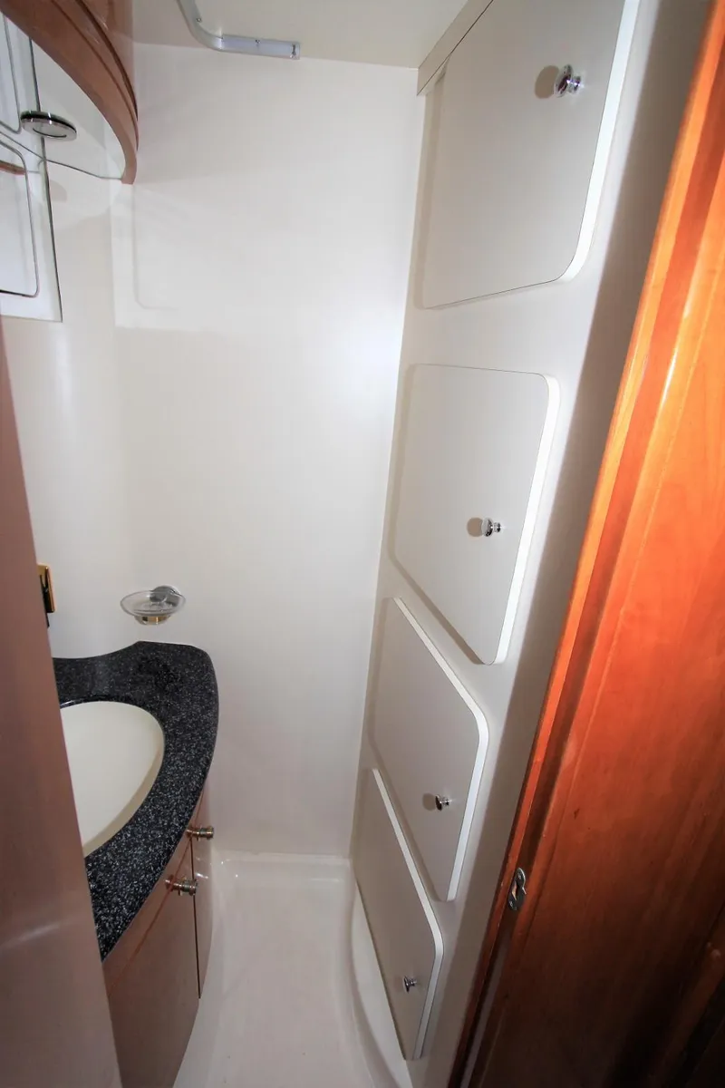 Slide: The Image of Bathroom of 2001 Carver 506 Motor Yacht with storage and sink. - 32