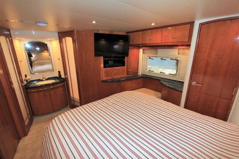 Slide: The Image of Luxurious cabin of 2001 Carver 506 Motor Yacht with TV and sink. - 35