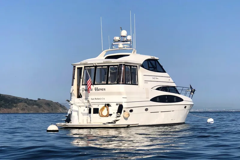 Slide: The Image of 2001 Carver 506 Motor Yacht on calm water. - 4