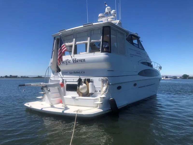 Slide: The Image of 2001 Carver 506 Motor Yacht on calm waters. - 5