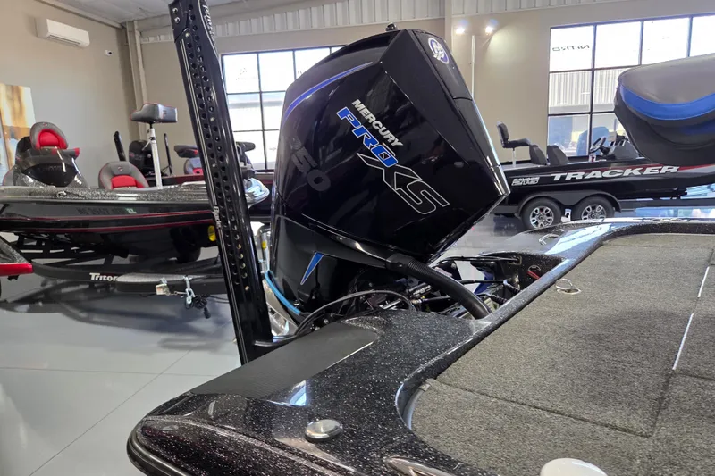 Slide: The Image of 2023 Caymas CX 20 boat with Mercury Pro XS engine in showroom. - 7