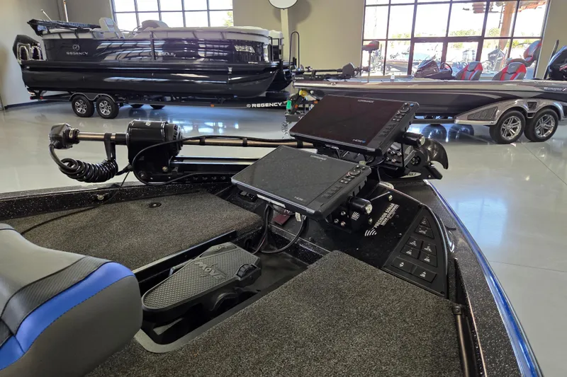 Slide: The Image of 2023 Caymas CX 20 boat interior with advanced navigation equipment and controls. - 9