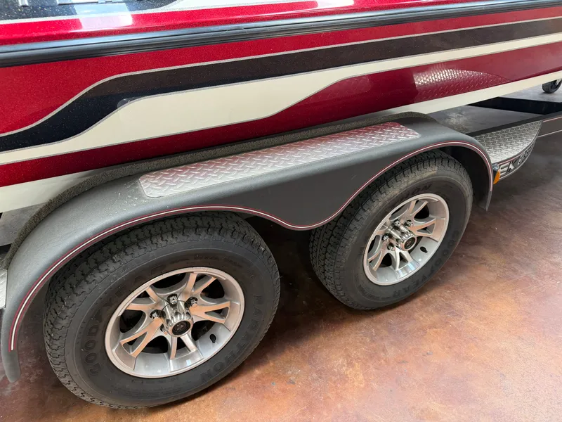 Slide: The Image of 2016 Skeeter ZX225 boat trailer with dual axles and tires. - 16