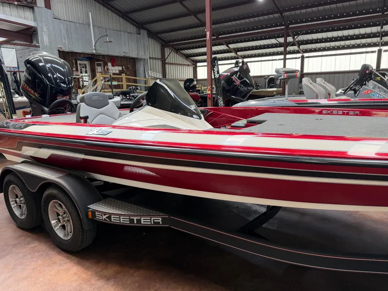 Slide: The Image of 2016 Skeeter ZX225 bass boat in a storage facility. - 3
