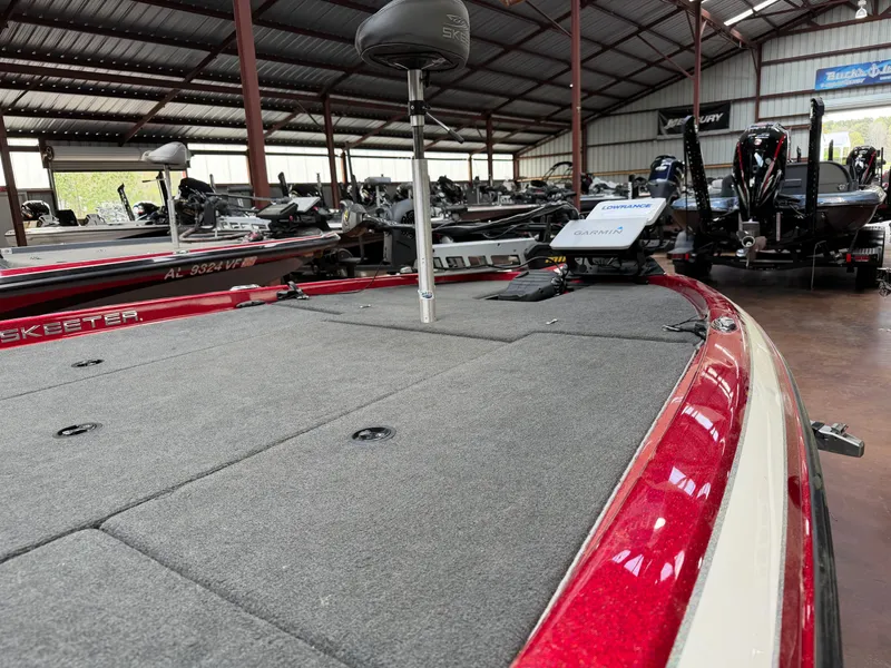 Slide: The Image of 2016 Skeeter ZX225 boat with gray deck in warehouse. - 4