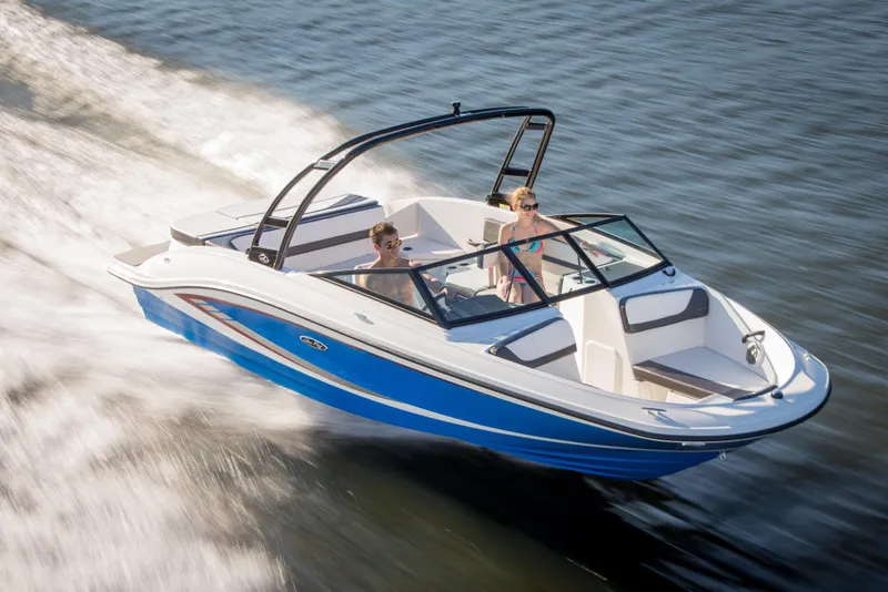 Slide: The Image of Interior of a 2016 Sea Ray 21 SPX boat with steering console. - 11