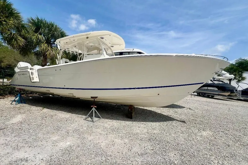 The Image of 2024 Cobia 350 Center Console boat on display outdoors. - 1