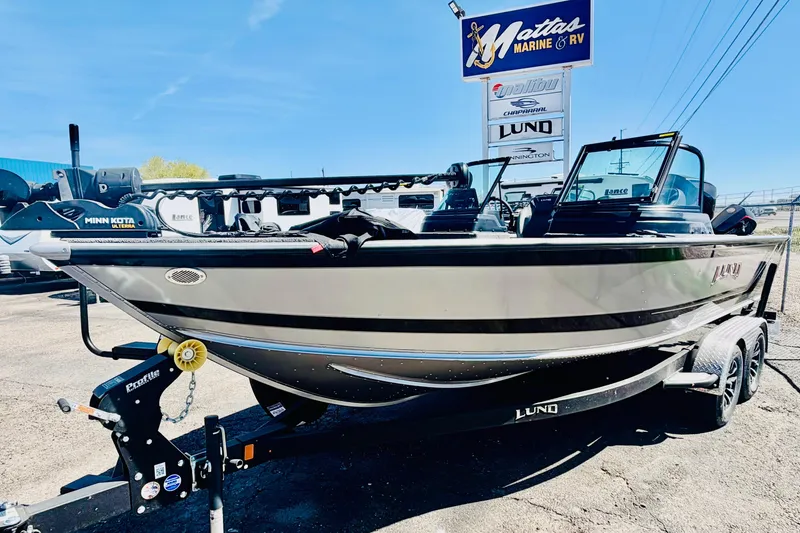 The Image of 2026 Lund 2075 Impact XS boat on trailer at Mattas Marine & RV dealership. - 1