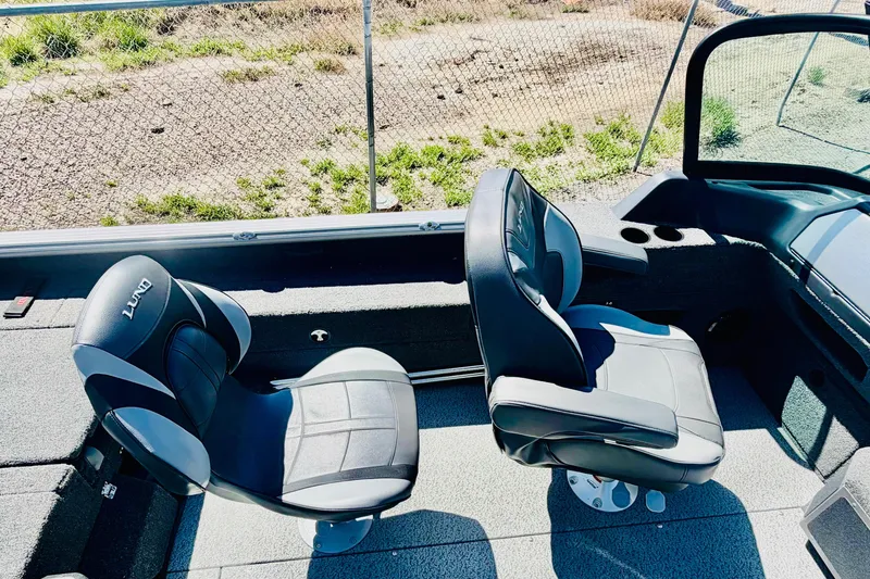 Slide: The Image of Interior of 2026 Lund 2075 Impact XS boat with two black seats. - 11