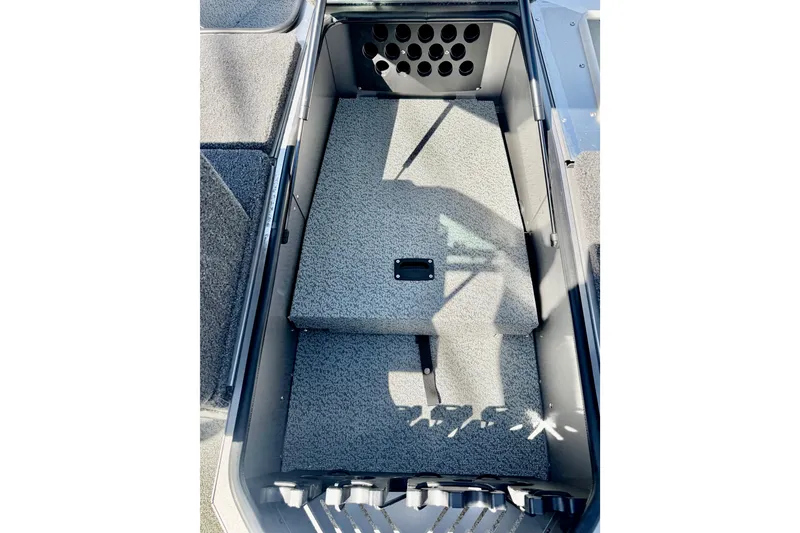 Slide: The Image of Interior view of 2026 Lund 2075 Impact XS boat storage compartment. - 15