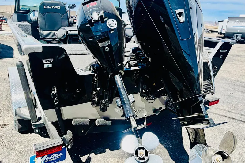 Slide: The Image of 2026 Lund 2075 Impact XS boat with dual outboard motors, rear view. - 6