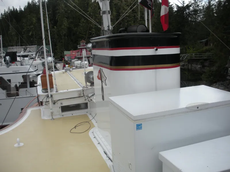 Slide: The Image of 1929 Custom HOFFAR-BEECHING Fantail Yacht deck with storage and Canadian flag. - 18