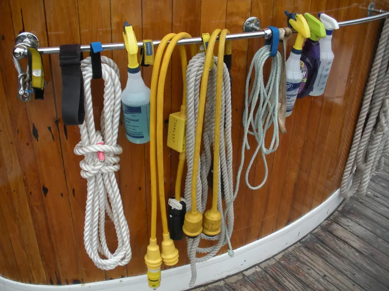 Slide: The Image of Cleaning supplies and ropes hanging on a 1929 HOFFAR-BEECHING Fantail Yacht. - 25