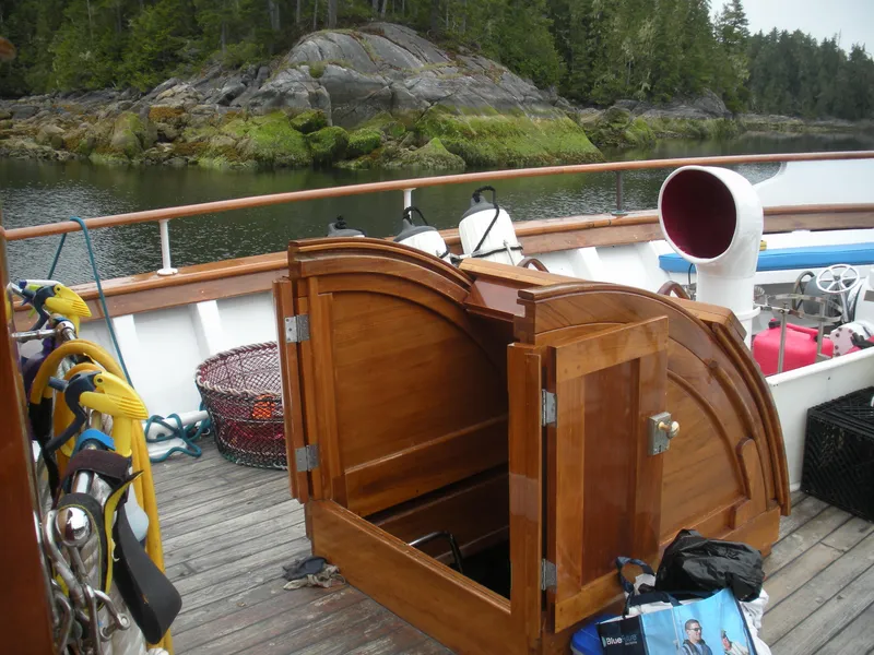 Slide: The Image of 1929 HOFFAR-BEECHING Fantail Yacht with open wooden cabinet on deck. - 28