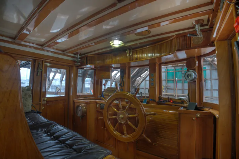 Slide: The Image of Interior of 1929 Custom HOFFAR-BEECHING Fantail Yacht with wooden helm and vintage design. - 35