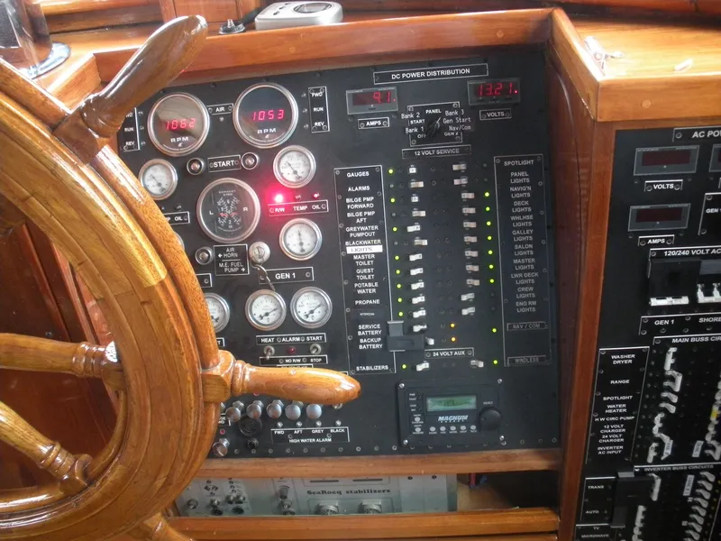 Slide: The Image of 1929 HOFFAR-BEECHING Fantail Yacht control panel with wooden steering wheel and gauges. - 39