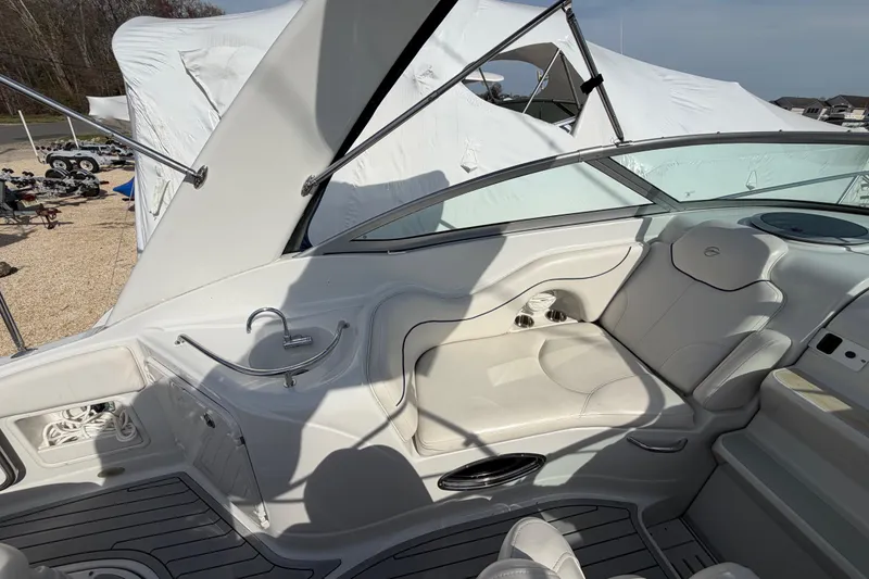 Slide: The Image of 2006 Crownline 270 CR boat interior with white seating and sleek design. - 11